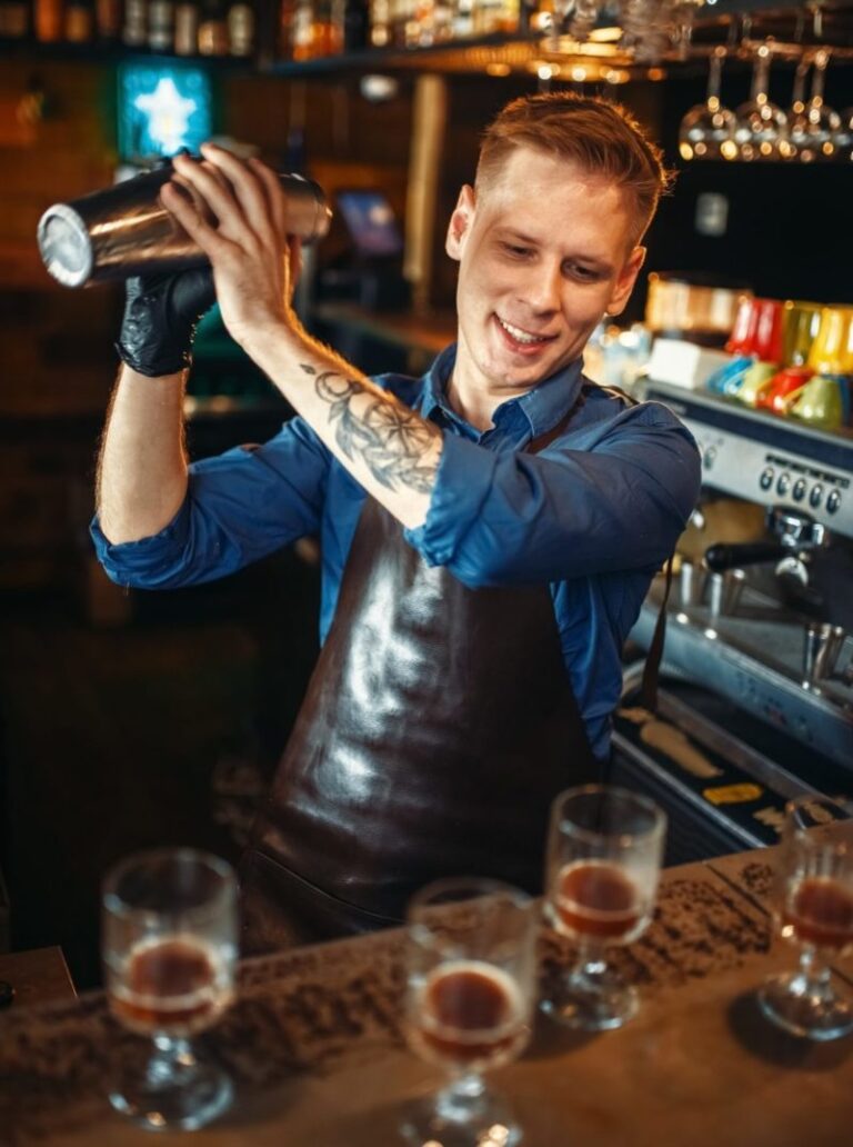bartender-works-with-shaker-at-the-bar-counter-e1633793140347.jpg